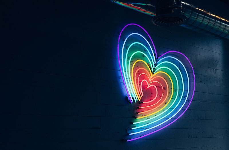 Multi-coloured heart made of neon lights